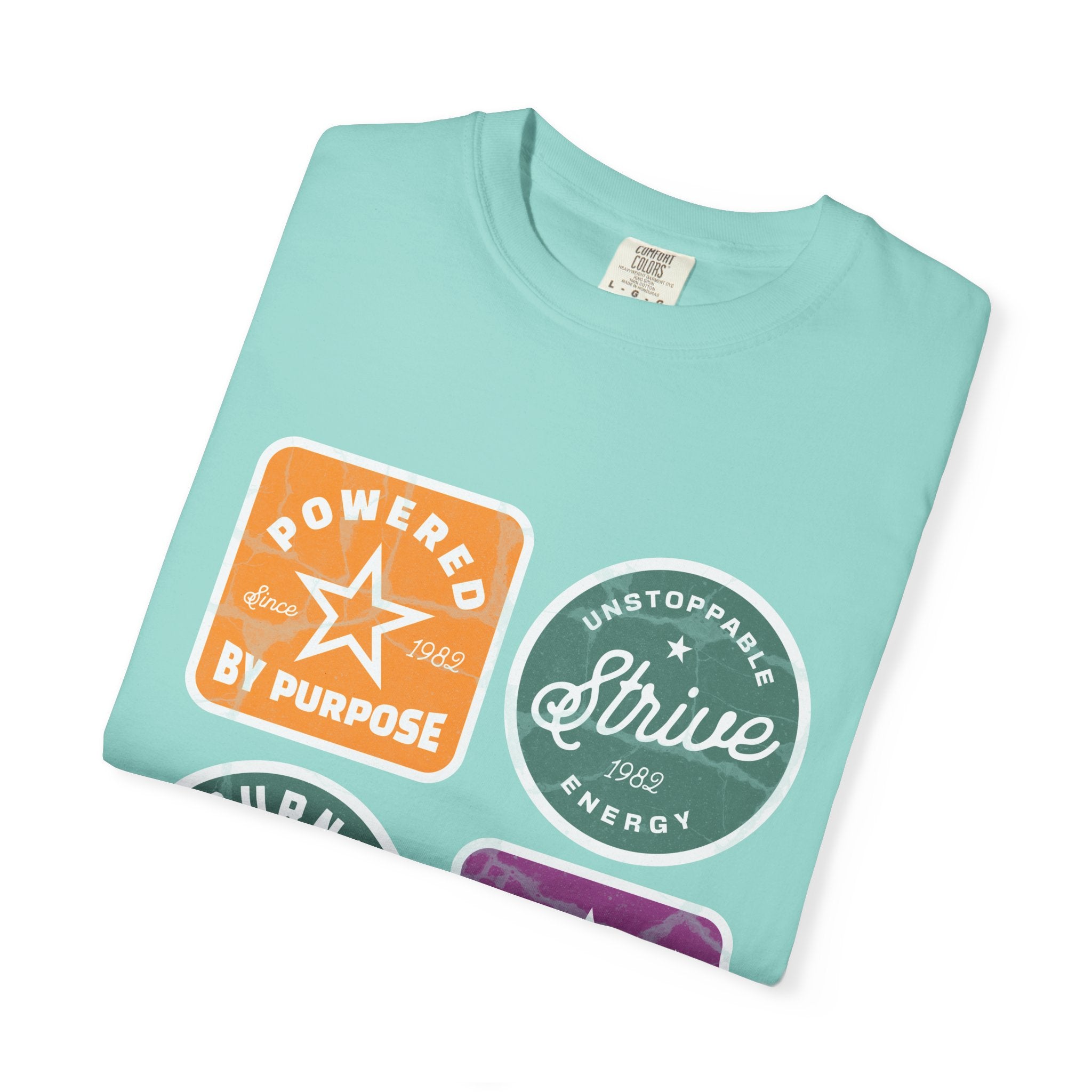 Motivational Badge T-Shirt — "Powered by Purpose / Strive / Journey / Freedom"