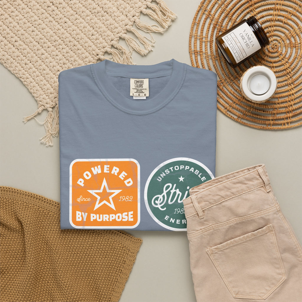 Motivational Badge T-Shirt — "Powered by Purpose / Strive / Journey / Freedom"