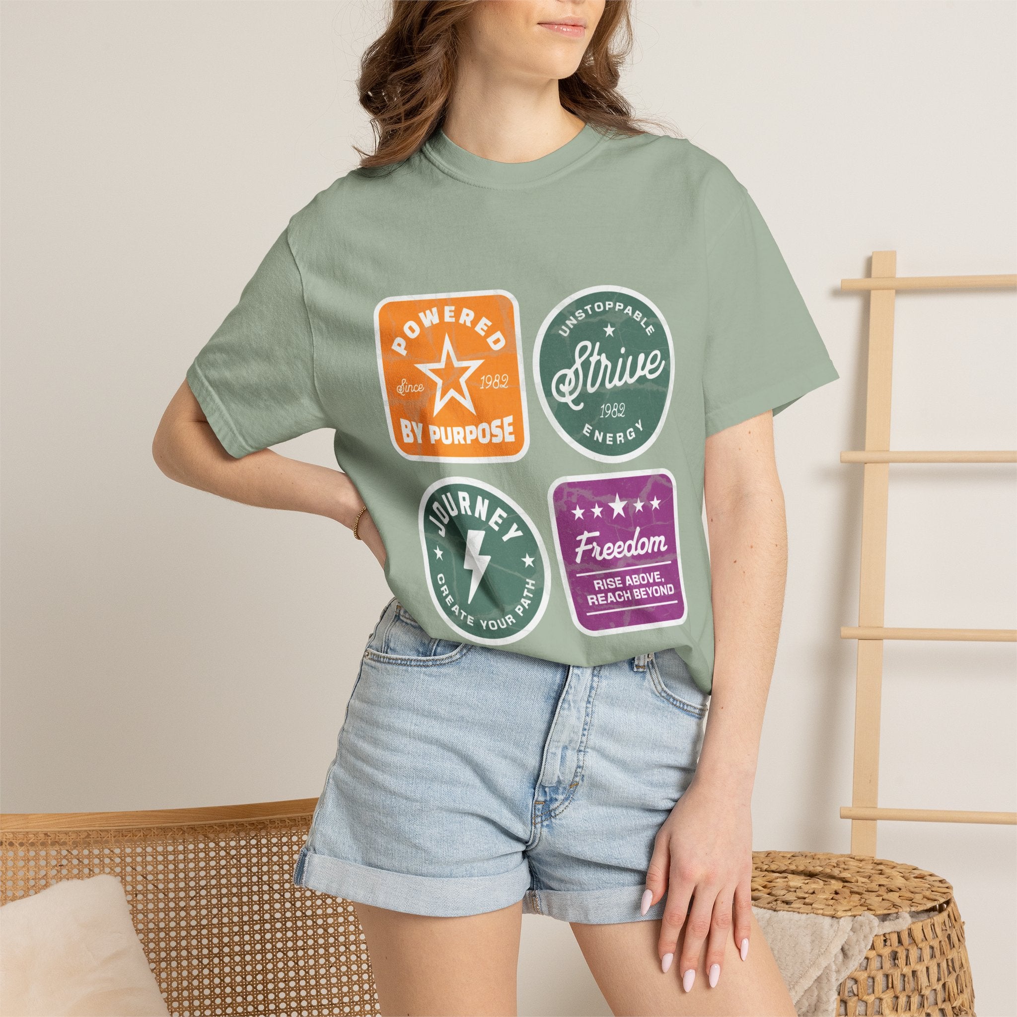 Motivational Badge T-Shirt — "Powered by Purpose / Strive / Journey / Freedom"
