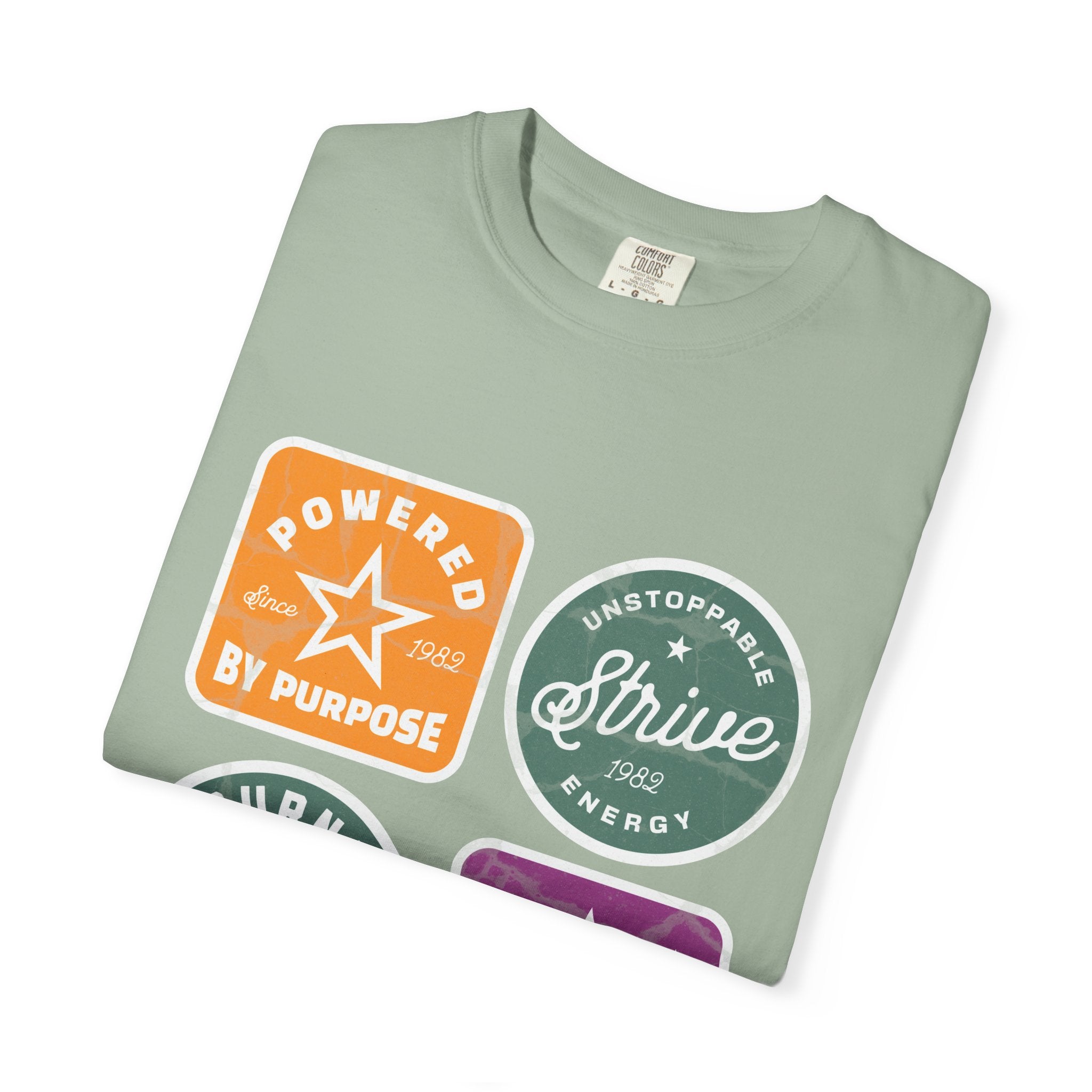 Motivational Badge T-Shirt — "Powered by Purpose / Strive / Journey / Freedom"