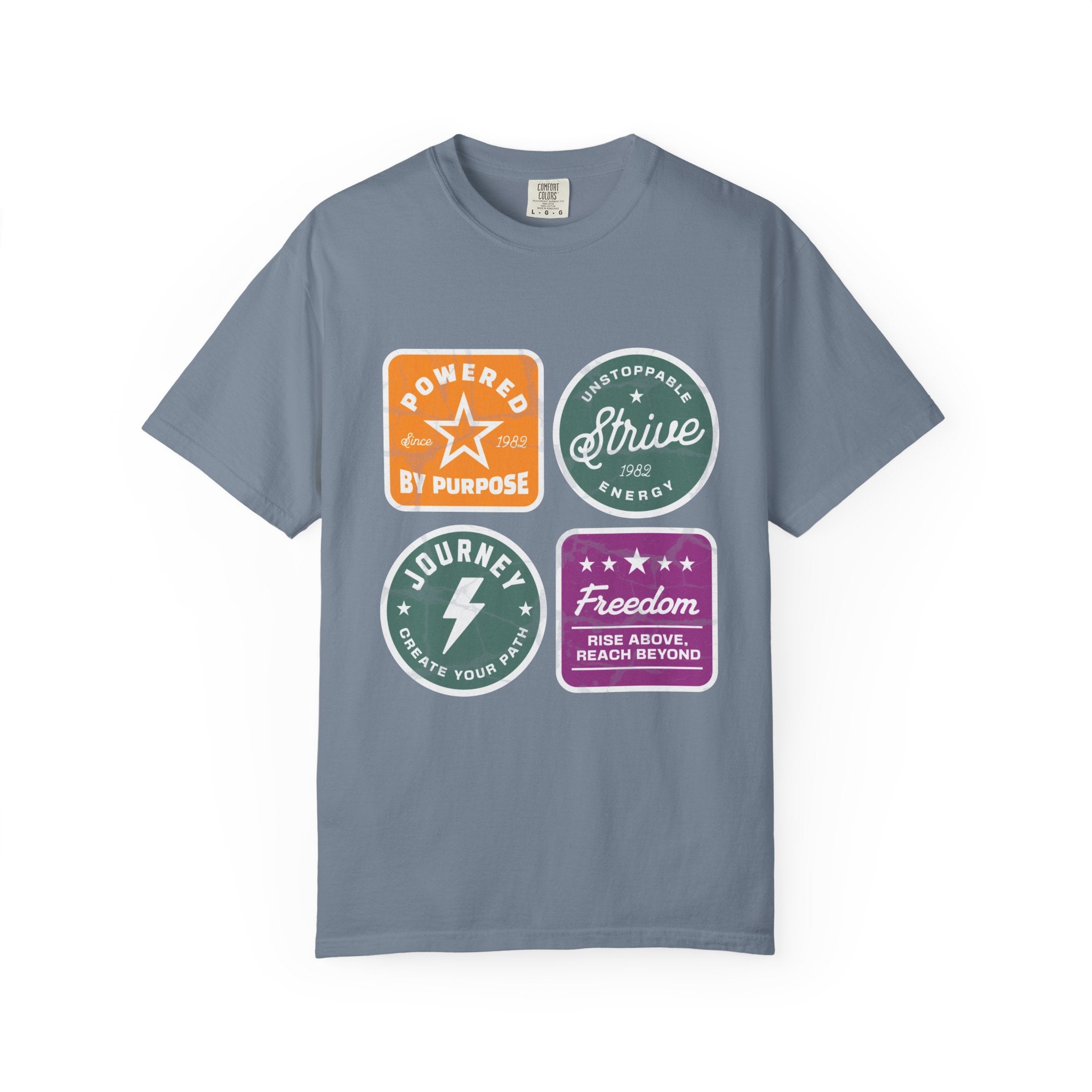 Motivational Badge T-Shirt — "Powered by Purpose / Strive / Journey / Freedom"